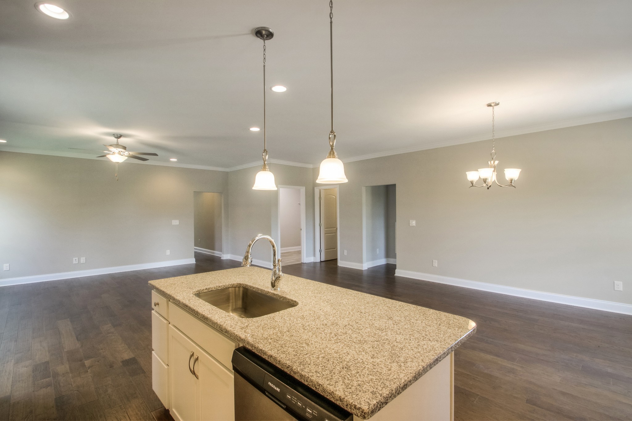 1529 Holton Road Gallatin, TN 37066 - Photo 9 of 33 a kitchen with a sink chandelier and wooden floor