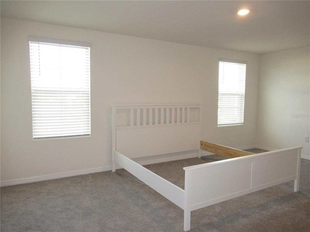 12178 Lily Magnolia Lane Riverview, FL 33569 - Photo 11 of 23 a view of an empty room with a window