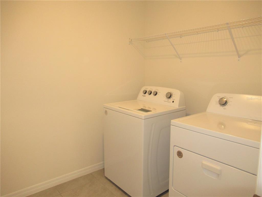 12178 Lily Magnolia Lane Riverview, FL 33569 - Photo 16 of 23 a utility room with dryer and washer