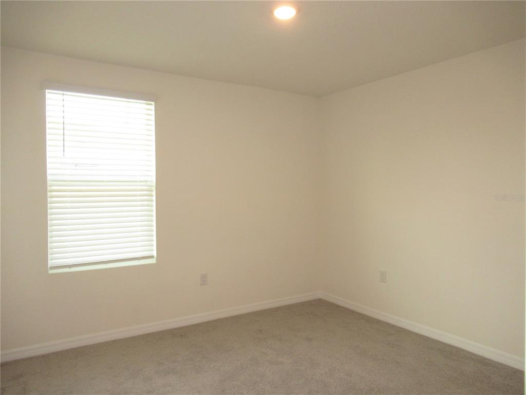 12178 Lily Magnolia Lane Riverview, FL 33569 - Photo 18 of 23 an empty room with a window