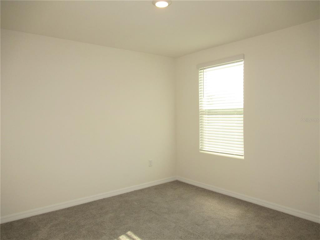 12178 Lily Magnolia Lane Riverview, FL 33569 - Photo 21 of 23 an empty room with a window