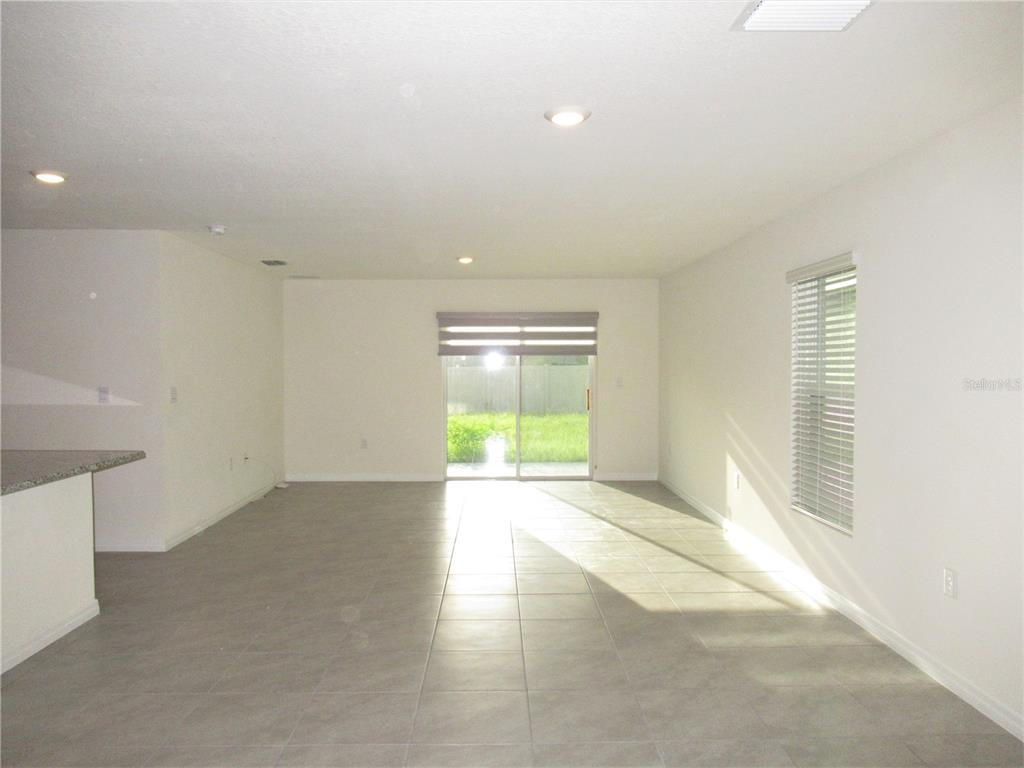 12178 Lily Magnolia Lane Riverview, FL 33569 - Photo 3 of 23 a view of an empty room with a window