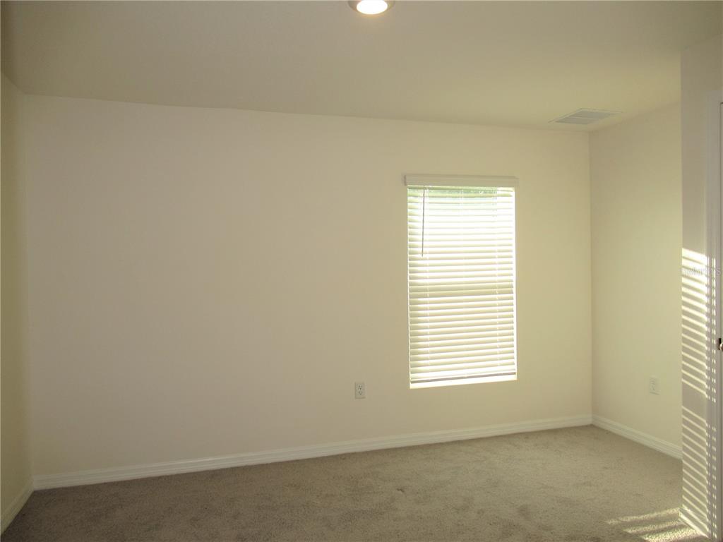 12178 Lily Magnolia Lane Riverview, FL 33569 - Photo 6 of 23 an empty room with a window