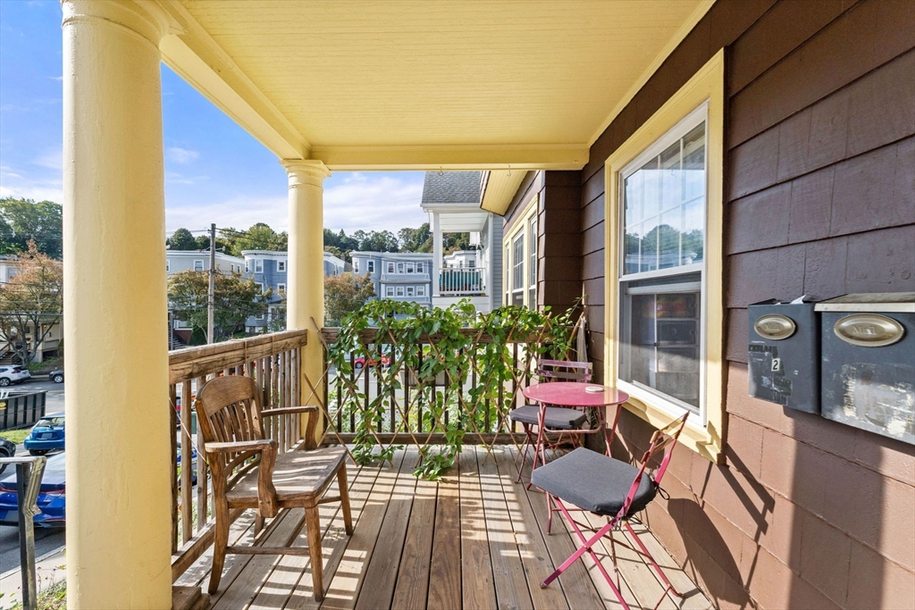 25 Tip Top Street, Unit 2 Boston, MA 02135 - Photo 3 of 35 a view of balcony with furniture