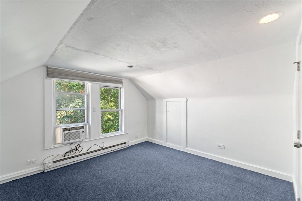 25 Tip Top Street, Unit 2 Boston, MA 02135 - Photo 32 of 35 an empty room with a window