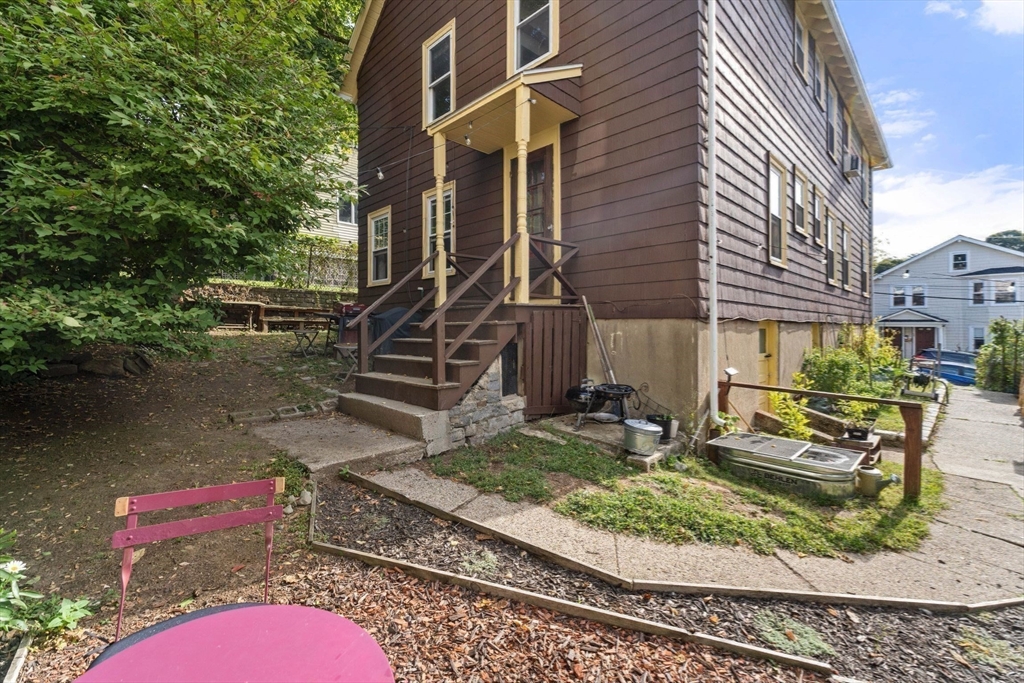 25 Tip Top Street, Unit 2 Boston, MA 02135 - Photo 34 of 35 a view of a house with backyard