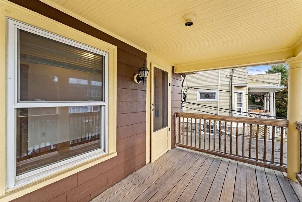 25 Tip Top Street, Unit 2 Boston, MA 02135 - Photo 5 of 35 a view of a house with a glass door