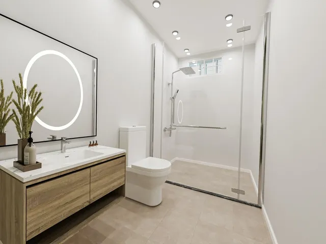 a bathroom with a double vanity sink mirror and toilet