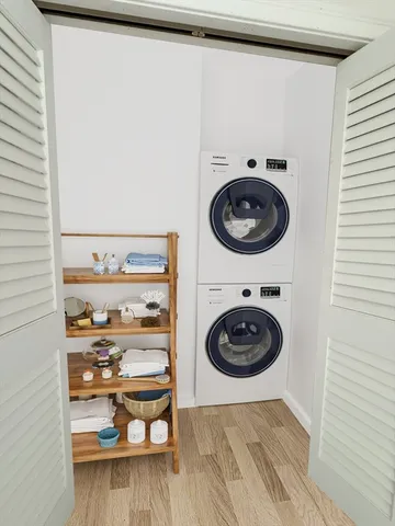 a view of a hallway with washer and dryer