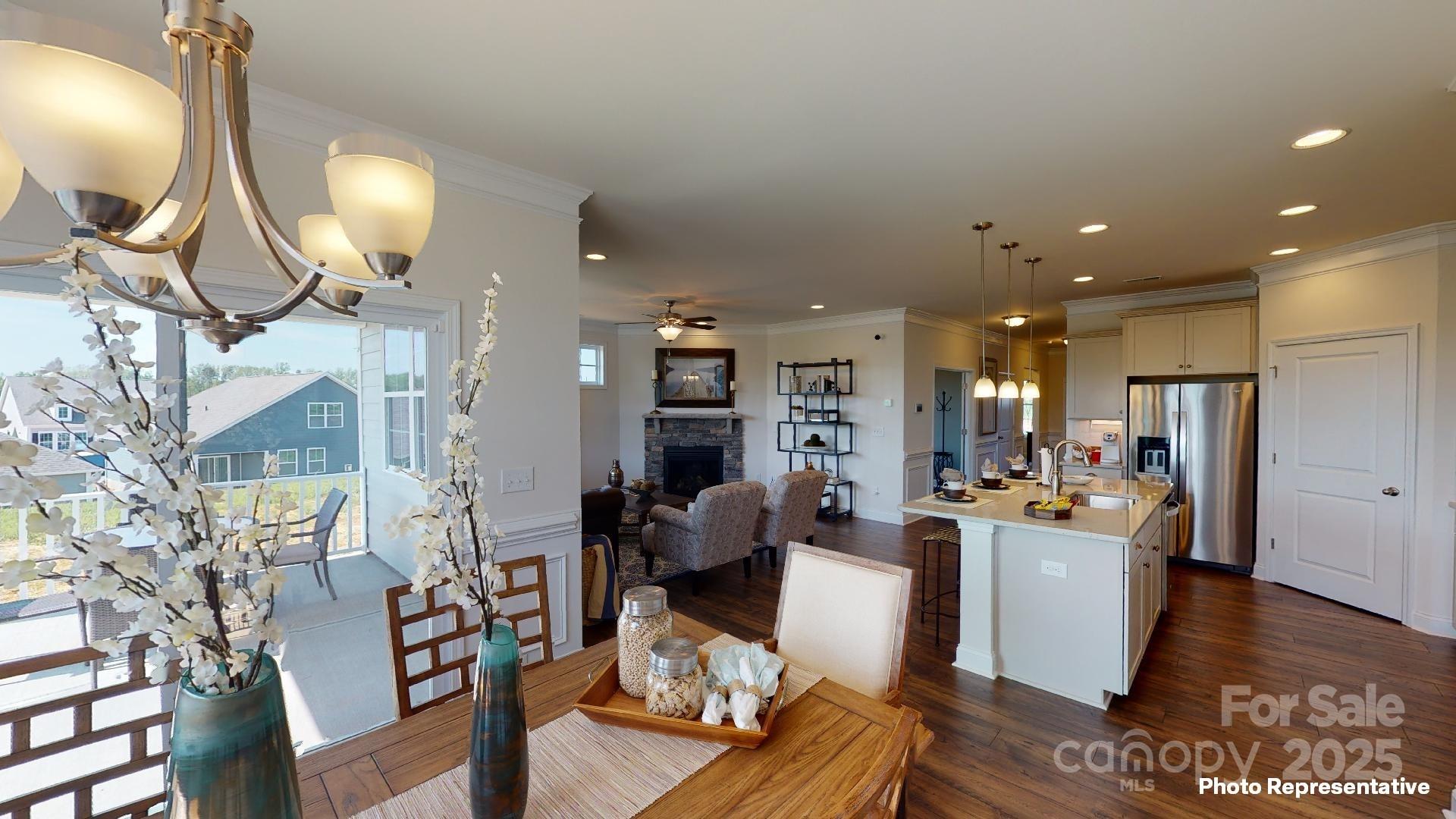 7653 Bainbridge Road Sherrills Ford, NC 28673 - Photo 17 of 25 a living room with furniture a rug and kitchen view