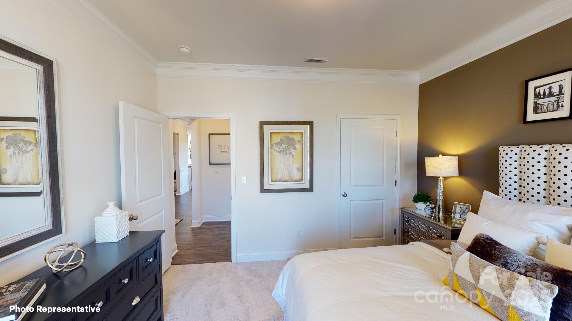 7653 Bainbridge Road Sherrills Ford, NC 28673 - Photo 4 of 25 a bedroom with a bed and wooden floor