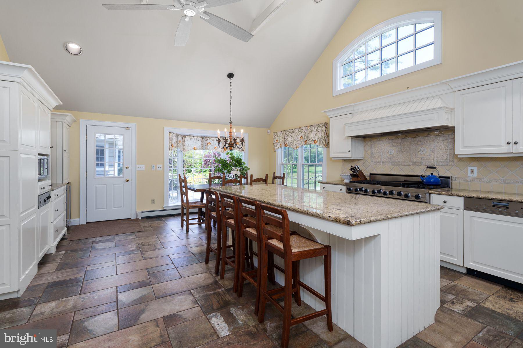 821 Pretty Brook Road Princeton, NJ 08540 - Photo 12 of 32 a kitchen with stainless steel appliances granite countertop a sink and a refrigerator