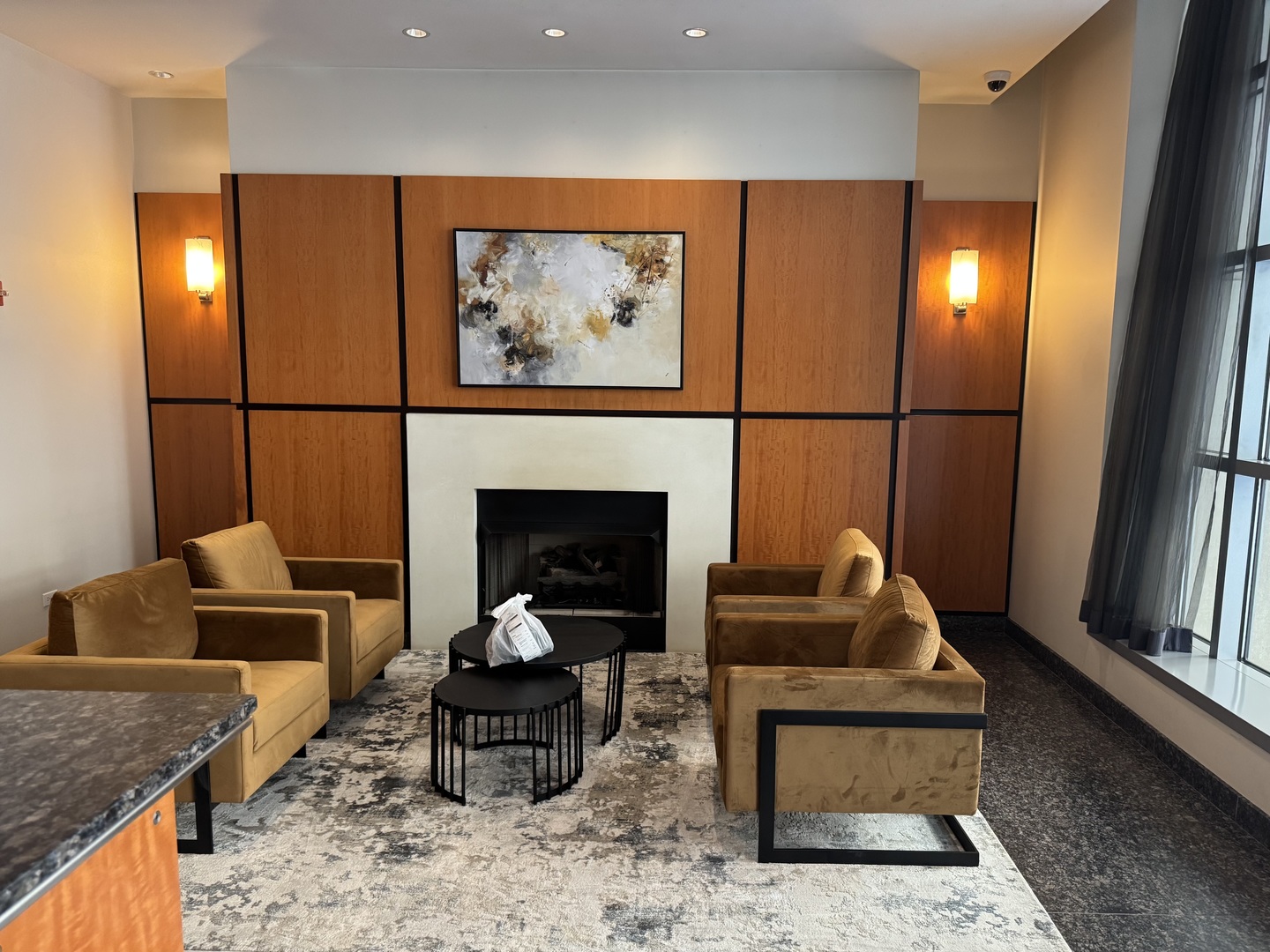 160 East Illinois Street, Unit 1805 Chicago, IL 60611 - Photo 15 of 17 a living room with furniture and a fireplace