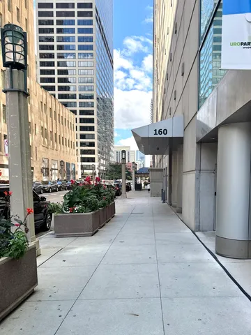 a view of building with yard and outdoor seating