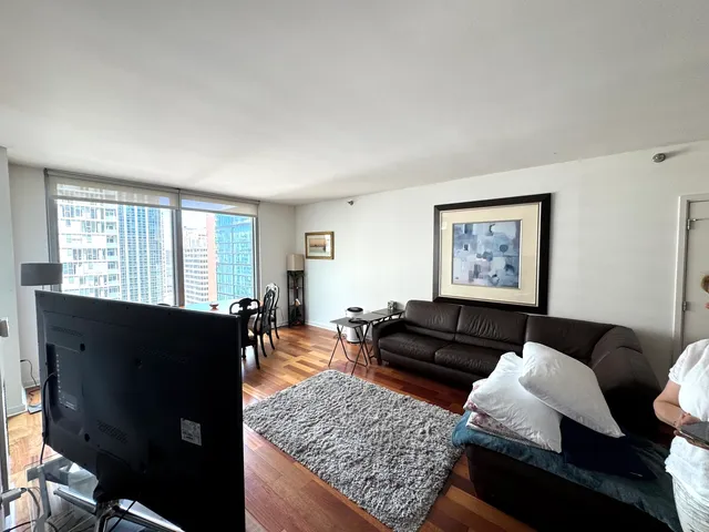 a bathroom with a double vanity sink a mirror and a shower