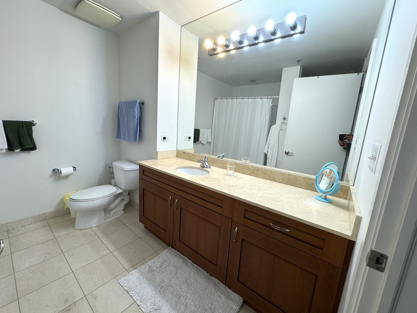 160 East Illinois Street, Unit 1805 Chicago, IL 60611 - Photo 6 of 17 a bathroom with a granite countertop sink a toilet and a mirror