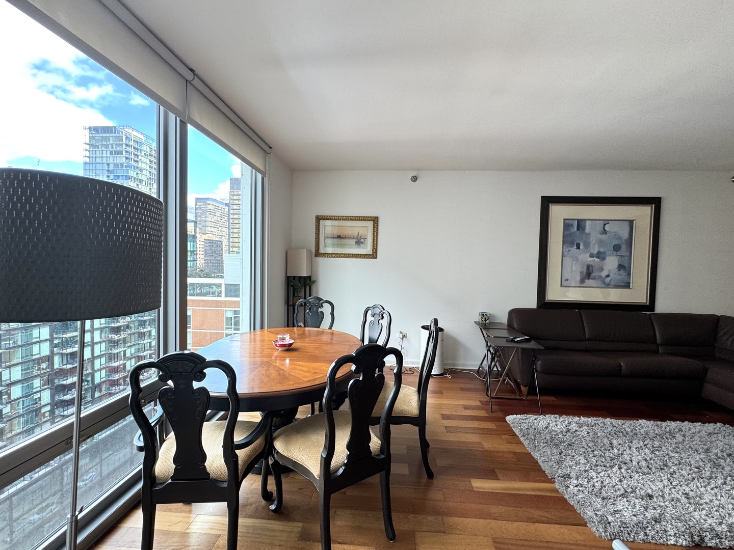 160 East Illinois Street, Unit 1805 Chicago, IL 60611 - Photo 9 of 17 a view of a dining room with furniture window and outside view