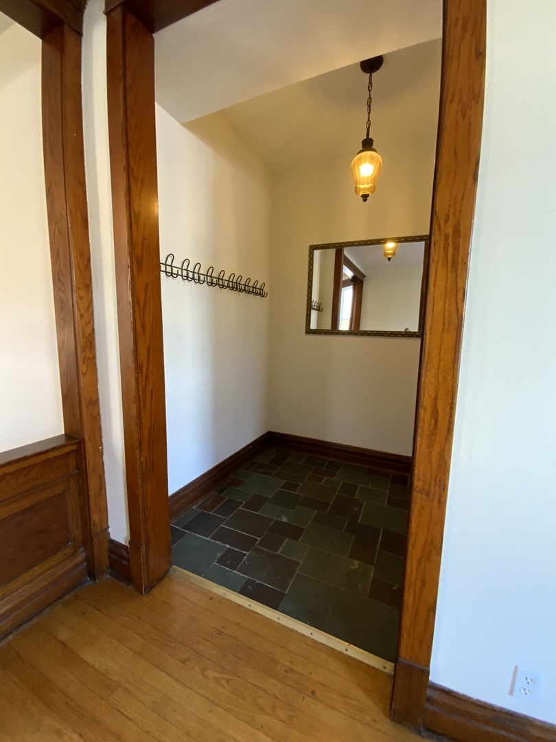 3116 North Elston Avenue, Unit 1 Chicago, IL 60618 - Photo 15 of 16 a view of a hallway with wooden floor