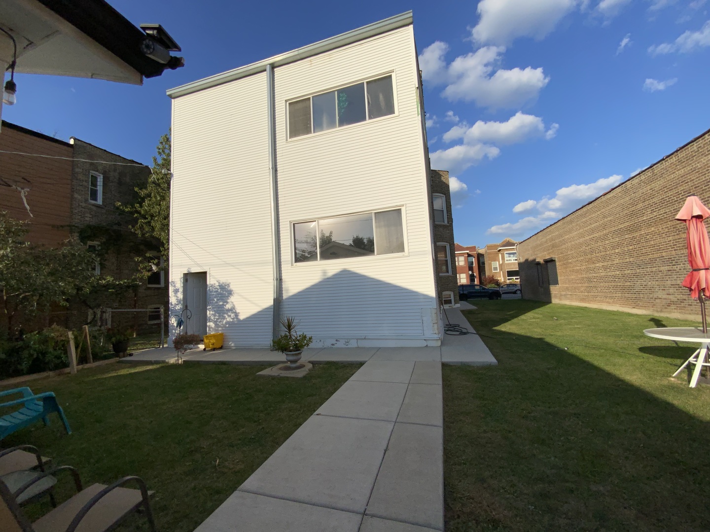 3116 North Elston Avenue, Unit 1 Chicago, IL 60618 - Photo 16 of 16 a view of a house with a yard