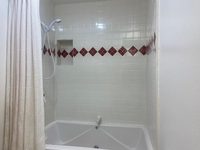 67 Hill Street Mammoth Lakes, CA 93546 - Photo 11 of 24 Bathroom featuring shower / bath combo with shower curtain