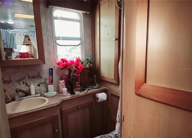a view of a swimming pool with a fountain in the background