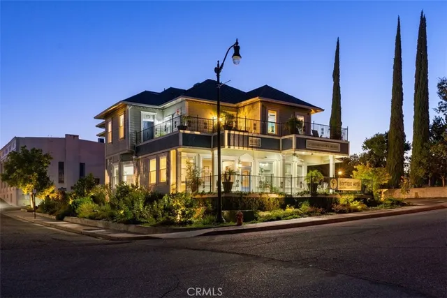 front view of a building with a garden