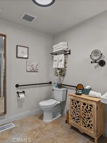 a bathroom with a sink vanity and a mirror