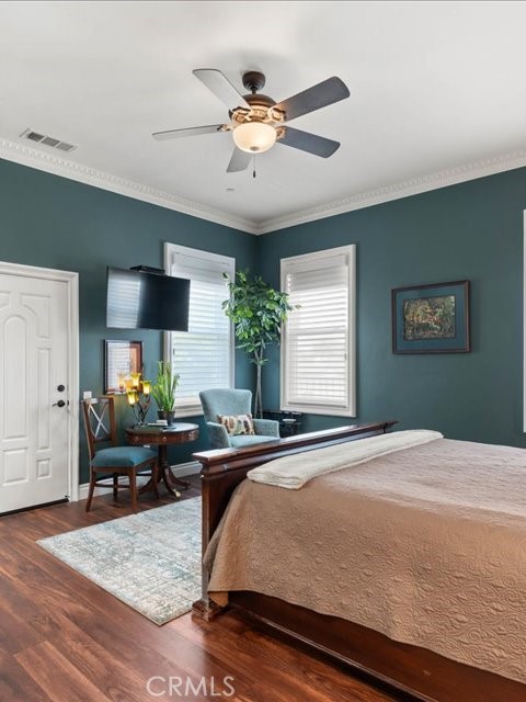 701 Rio Street Red Bluff, CA 96080 - Photo 43 of 72 a bed room with a bed and a chandelier