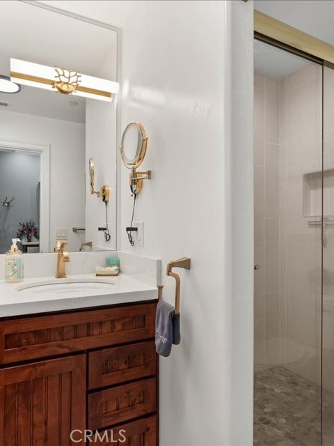 701 Rio Street Red Bluff, CA 96080 - Photo 50 of 72 a bathroom with a sink vanity and a mirror