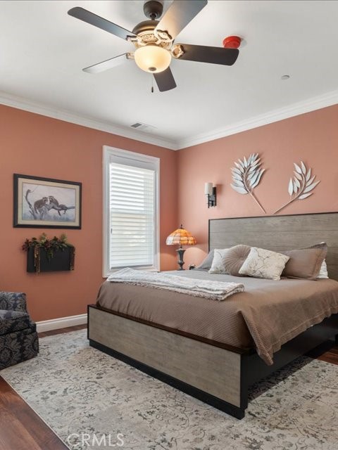 701 Rio Street Red Bluff, CA 96080 - Photo 51 of 72 a bedroom with a bed and a chandelier