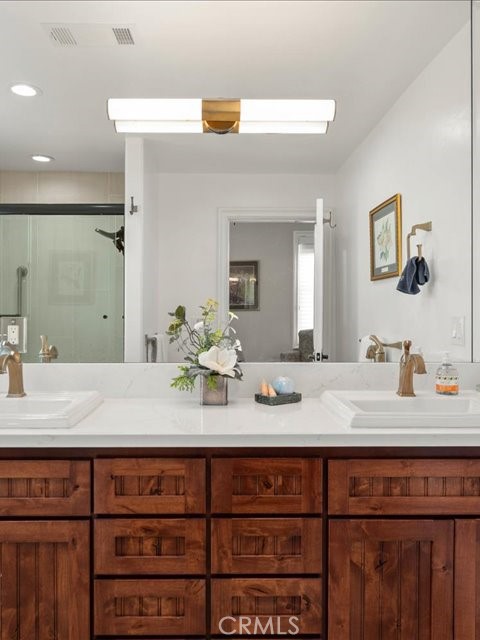 701 Rio Street Red Bluff, CA 96080 - Photo 67 of 72 a bathroom with a granite countertop sink and a mirror