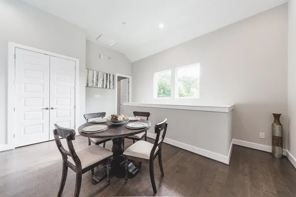 a dining room with furniture and window