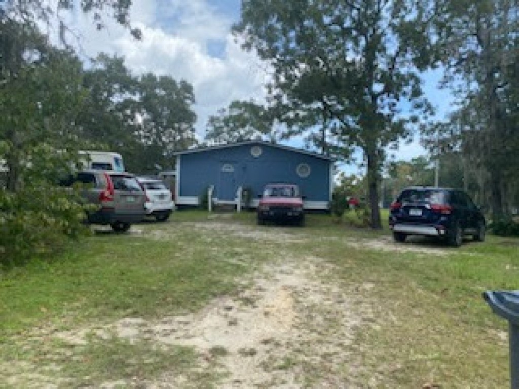 97119 Diamond Street Yulee, FL 32097 - Photo 2 of 6 a car parked in front of a house