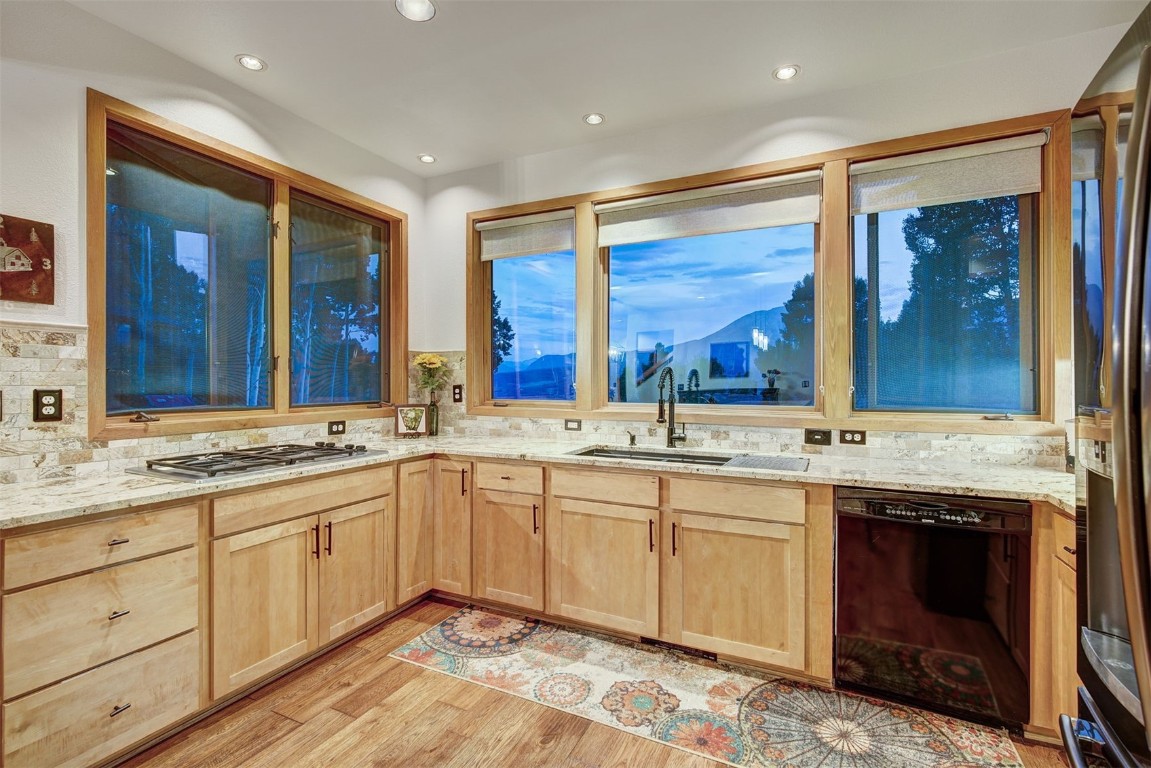 2210 Hamilton Creek Road Silverthorne, CO 80498 - Photo 15 of 50 a spacious bathroom with a granite countertop sink and a large mirror