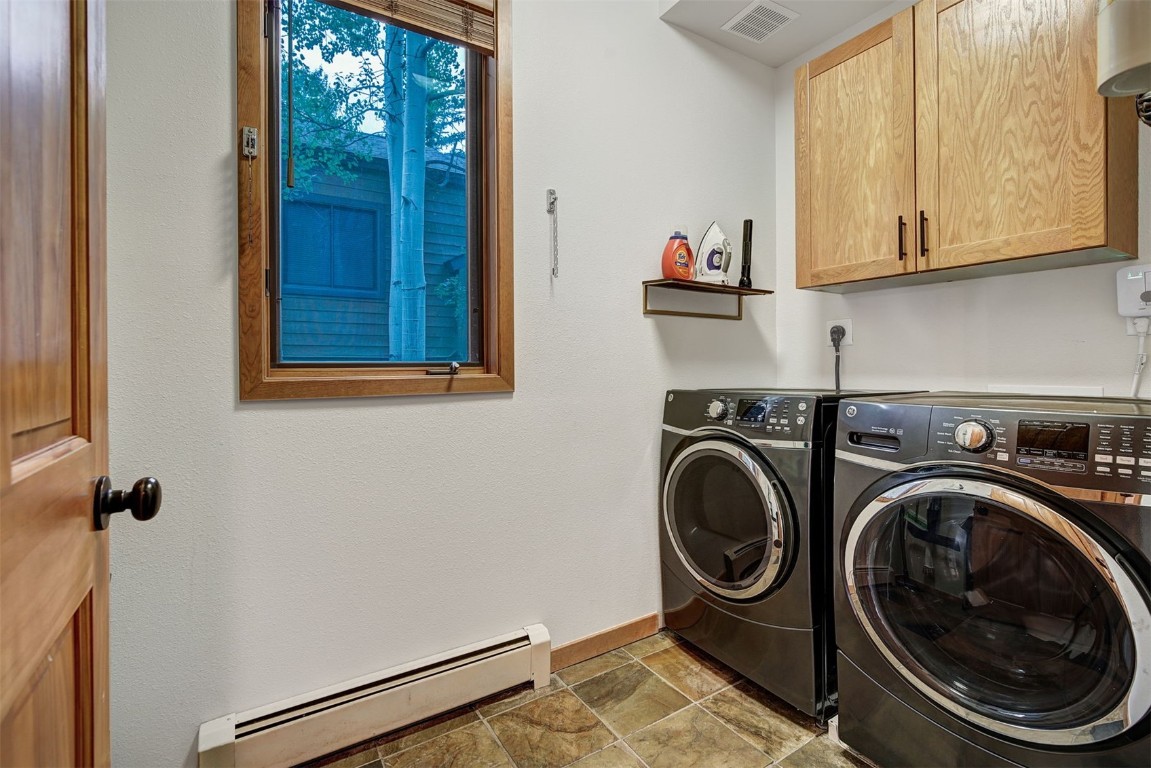 2210 Hamilton Creek Road Silverthorne, CO 80498 - Photo 21 of 50 a utility room with sink dryer and washer