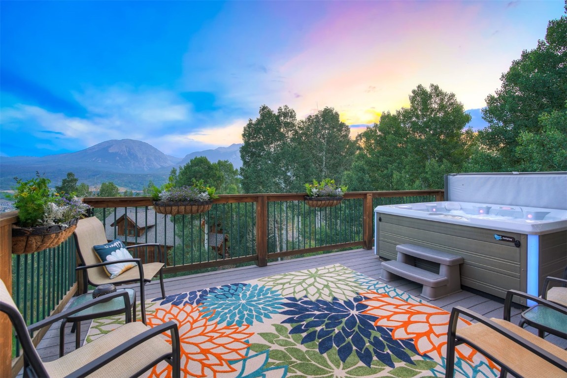 2210 Hamilton Creek Road Silverthorne, CO 80498 - Photo 25 of 50 a backyard of a house with table and chairs