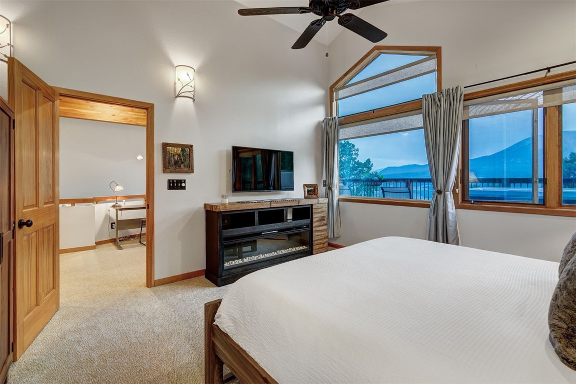 2210 Hamilton Creek Road Silverthorne, CO 80498 - Photo 30 of 50 a large bedroom with a bed and a television