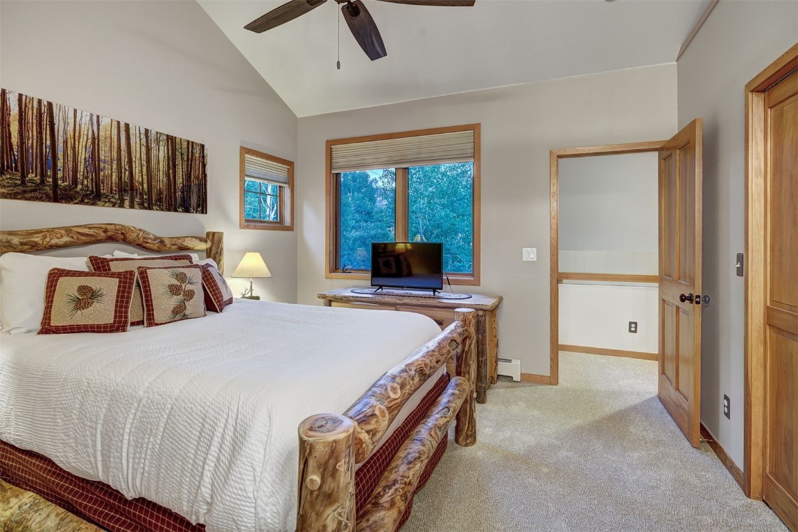 2210 Hamilton Creek Road Silverthorne, CO 80498 - Photo 34 of 50 a bedroom with a bed and a large window