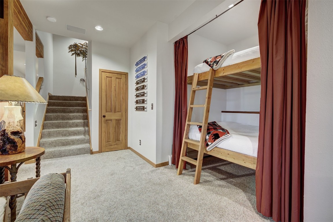 2210 Hamilton Creek Road Silverthorne, CO 80498 - Photo 38 of 50 a view of a livingroom with furniture and a hallway