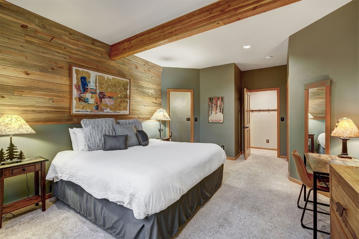 2210 Hamilton Creek Road Silverthorne, CO 80498 - Photo 40 of 50 a bedroom with a bed and a table in it