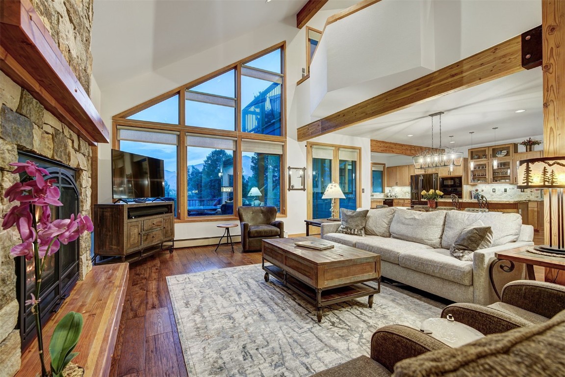 2210 Hamilton Creek Road Silverthorne, CO 80498 - Photo 5 of 50 a living room with furniture wooden floor and a flat screen tv