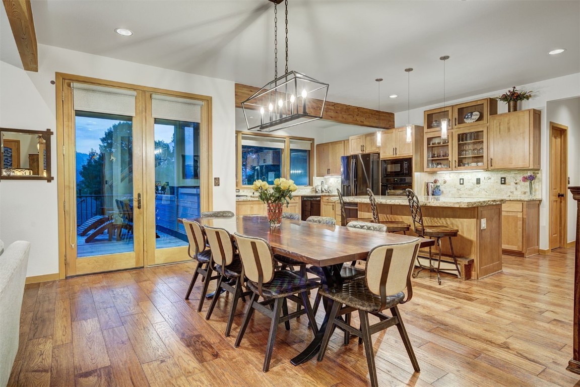 2210 Hamilton Creek Road Silverthorne, CO 80498 - Photo 7 of 50 a view of a dining area with furniture window and wooden floor