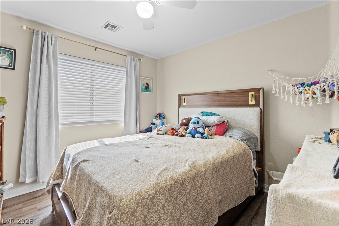 1419 Red Sunset Avenue Henderson, NV 89074 - Photo 26 of 35 Bedroom with wood finished floors and a ceiling fan