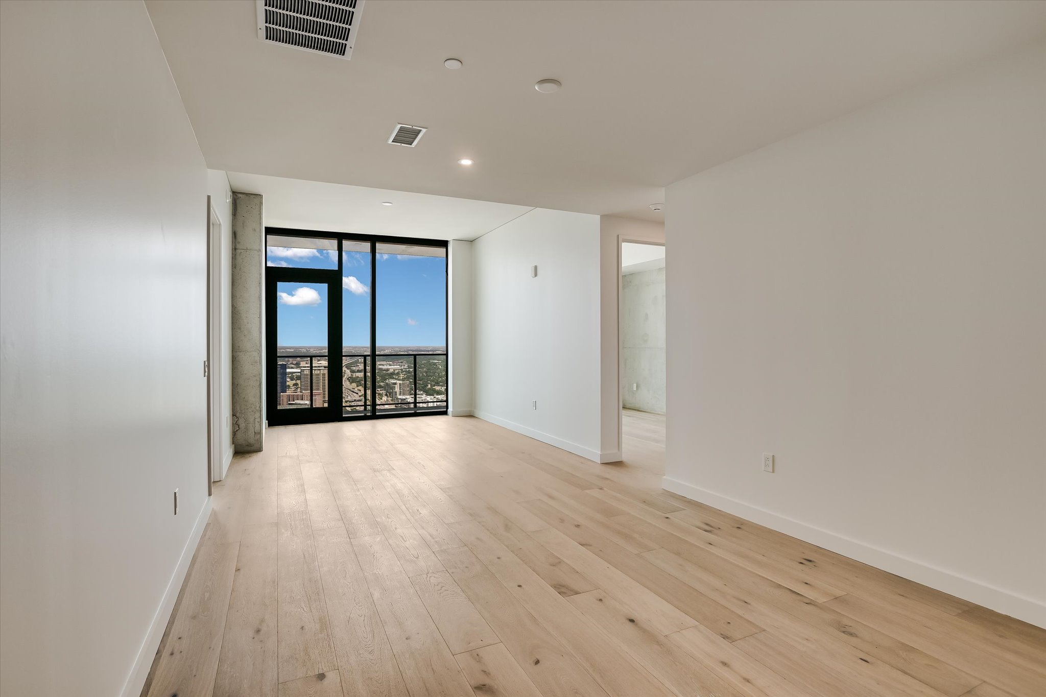 610 Davis Street, Unit 4704 Austin, TX 78701 - Photo 11 of 40 wooden floor in an empty room with a window