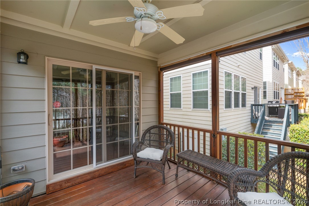 126 Pine Hawk Drive Spring Lake, NC 28390 - Photo 29 of 48 a view of a porch with wooden floor and furniture