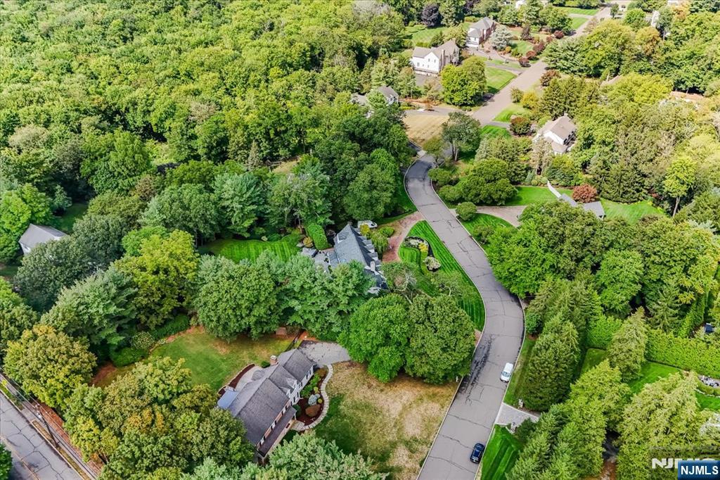 856 Stonewall Court Franklin Lakes, NJ 07417 - Photo 1 of 26 an aerial view of residential house with outdoor space and trees all around