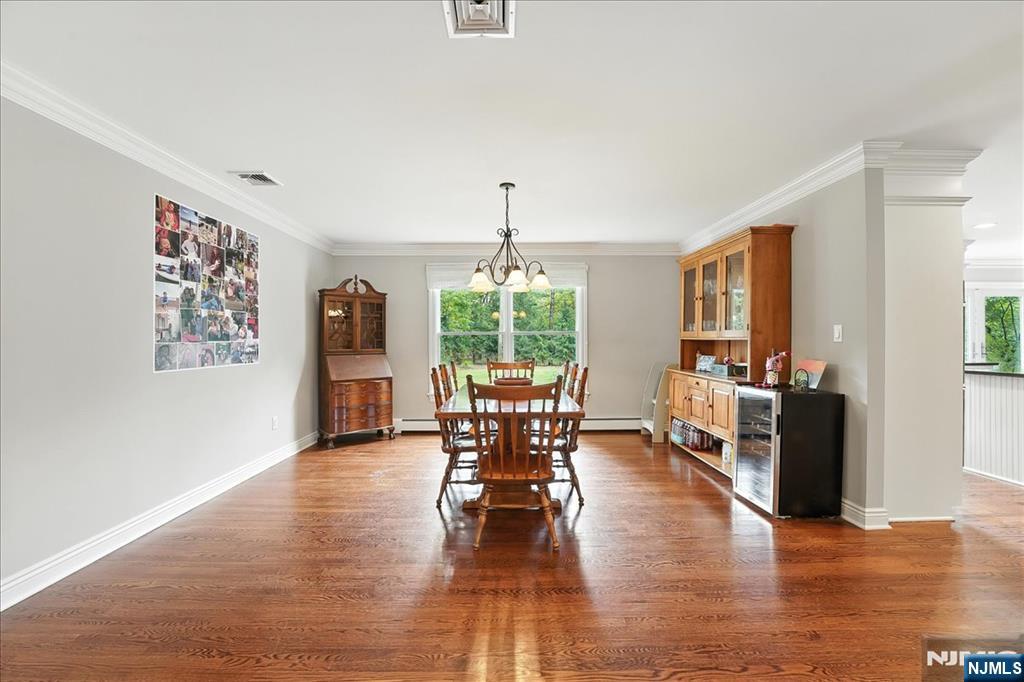 856 Stonewall Court Franklin Lakes, NJ 07417 - Photo 12 of 26 a living room with furniture large window and wooden floor