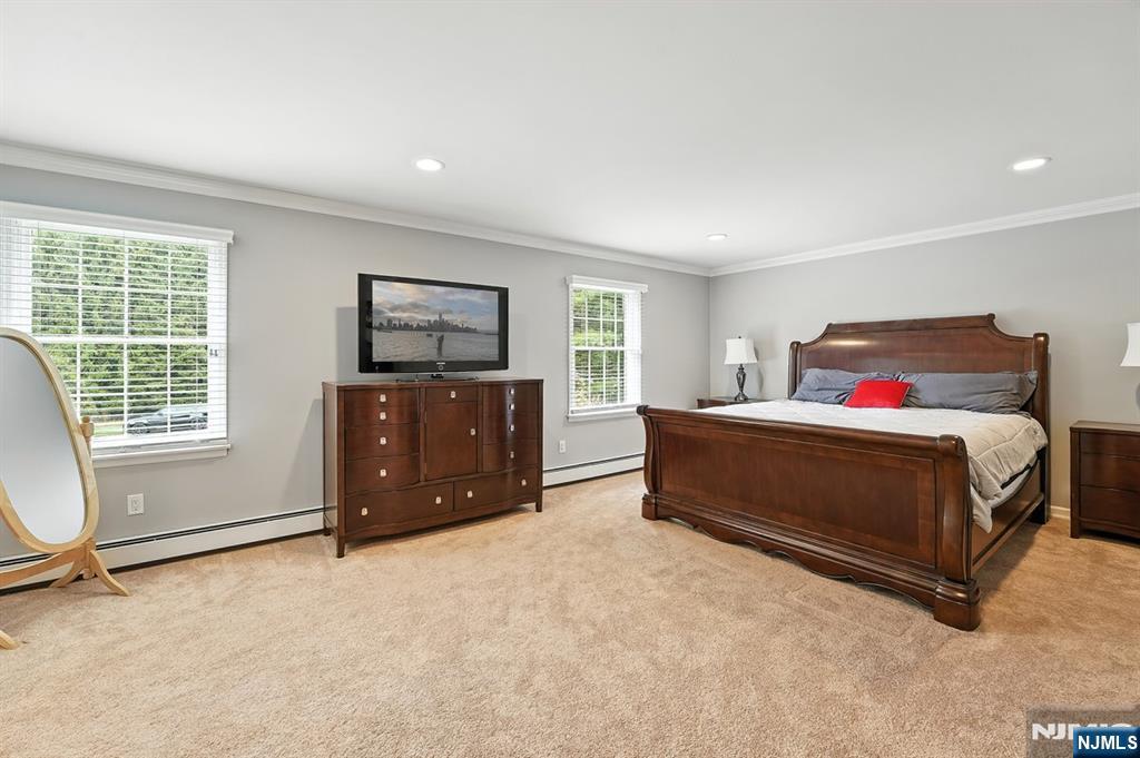 856 Stonewall Court Franklin Lakes, NJ 07417 - Photo 13 of 26 a spacious bedroom with a bed and a cabinets