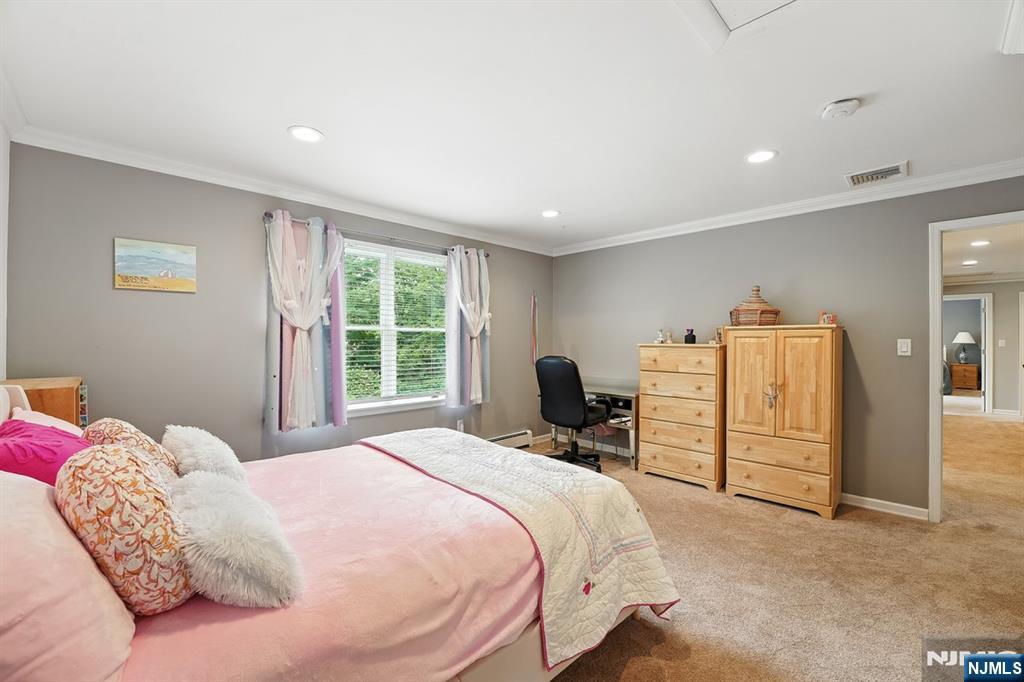 856 Stonewall Court Franklin Lakes, NJ 07417 - Photo 16 of 26 a bedroom with a bed dresser and a window