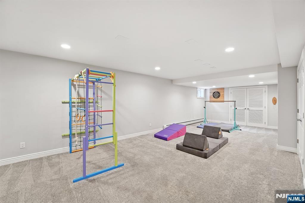 856 Stonewall Court Franklin Lakes, NJ 07417 - Photo 23 of 26 a room with gym equipment and white walls